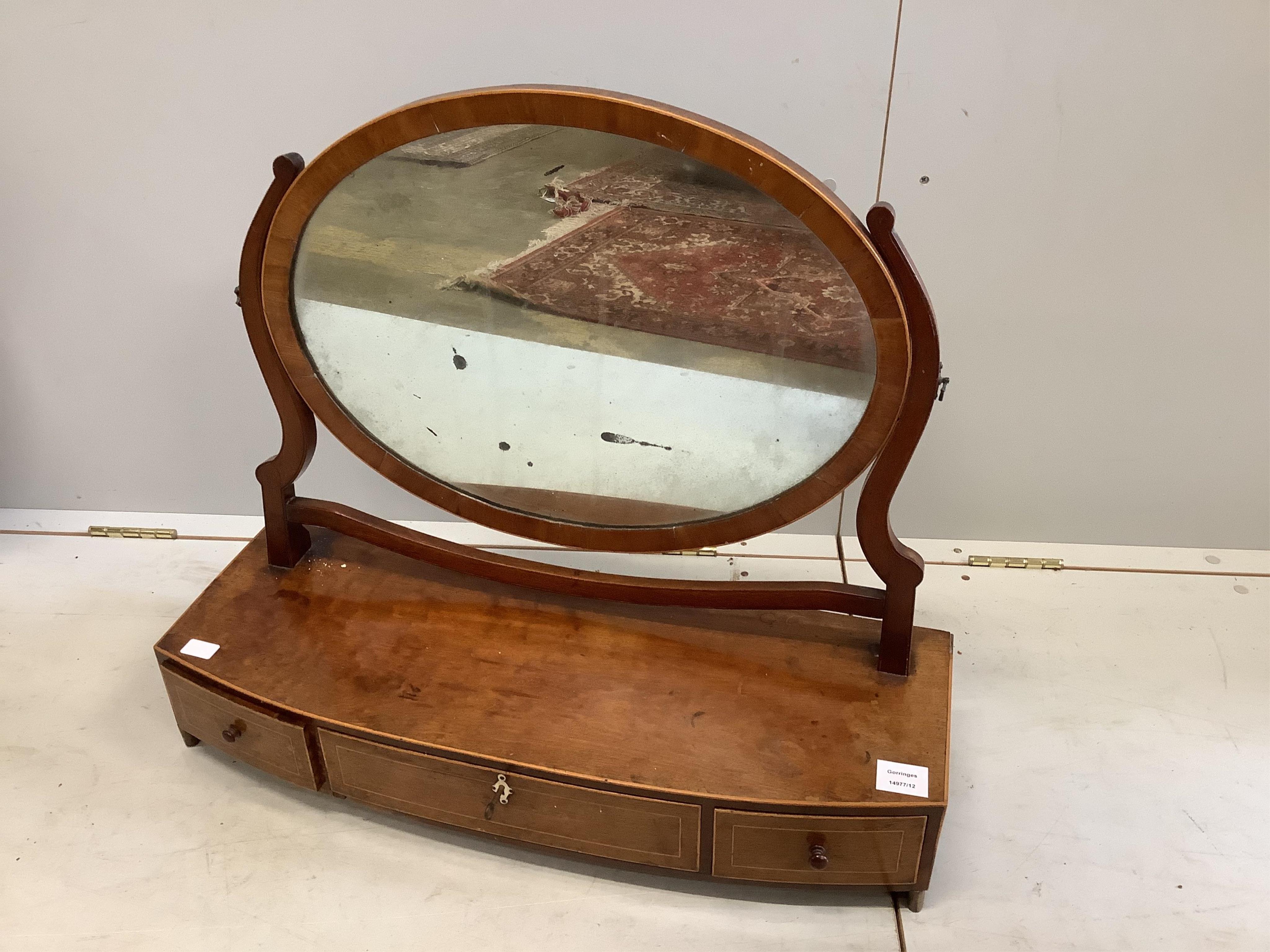 A George III mahogany bow fronted box base three drawer toilet mirror, width 72cm, height 81cm. Condition - fair